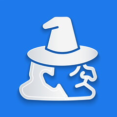 Paper cut Witch icon isolated on blue background. Happy Halloween party. Paper art style. Vector