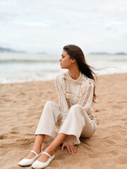 Blissful Serenity: A Captivating Woman Enjoying Solitude amidst Majestic Coastal Beauty - obrazy, fototapety, plakaty