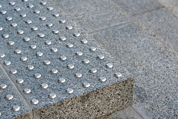 Stairs steps with anti-slip tactile stud system. Warning system for visually impaired individuals...