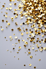 Golden Confetti Celebration on Light Background