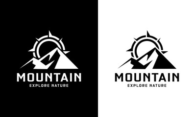 abstract mountain with compass behind the mountain logo design