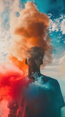 The image features an individual standing with their back to the camera against a dramatic backdrop of a cloudy sky. The person's head appears to be enveloped in a cloud of orange and blue smoke, whic
