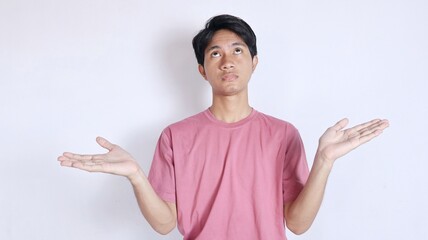 asian man with open arms and astonished expression while looking up