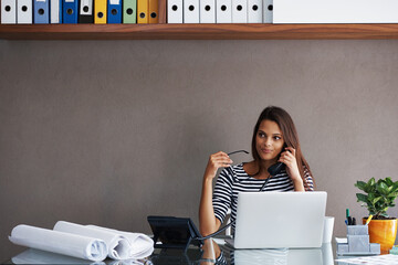 Woman, telephone and laptop at desk with call for discussion, conversation and talking to client....