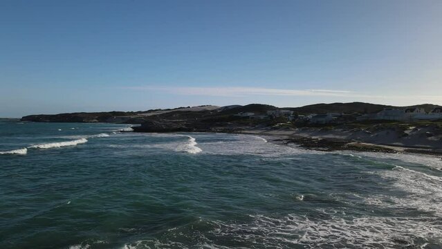 South African beautiful village Arniston embedded in Sand Dunes and a turquoise sea coast line