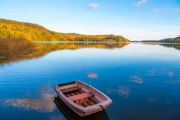 boat on the lake with autumn colors
