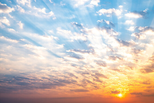 Sky, sunrise, sunset, luxury soft gradient orange gold clouds and gold sunlight between group of blue clound sky perfect for the background, take in everning,Twilight, high definition landscape photo