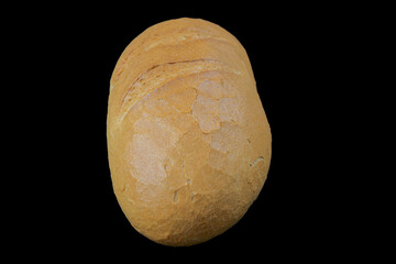 freshly baked wholemeal bread on black background top view