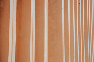 Background image: brown with vertical stripes arranged in rows for adding letters.
