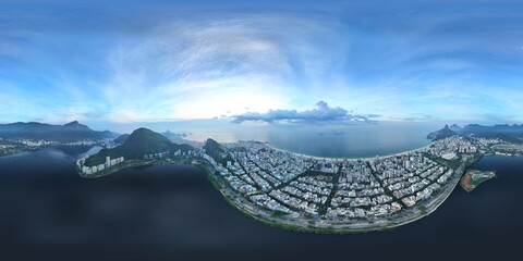 360 aerial photo taken with drone over lake in Ipanema between Corcovado and beach at sunrise