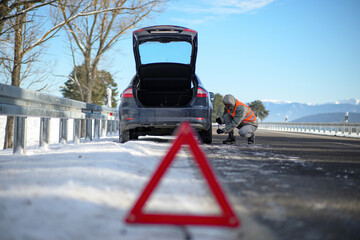 the driver of a motor vehicle had a car breakdown while driving on the road in winter, put a...