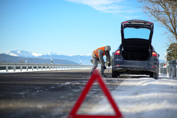 the driver of a motor vehicle had a car breakdown while driving on the road in winter, put a...