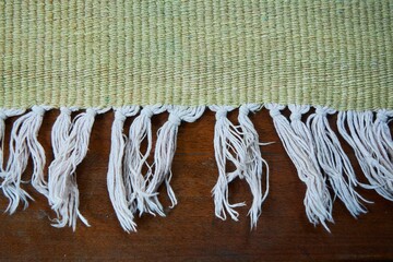 Fringe on an old rug or plaid. Vintage fabrics