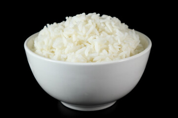 White rice in bowl on wood table.