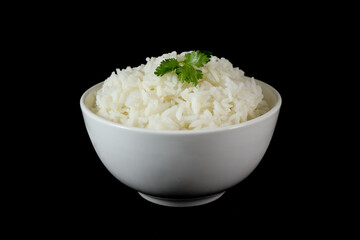 White rice in bowl, black background