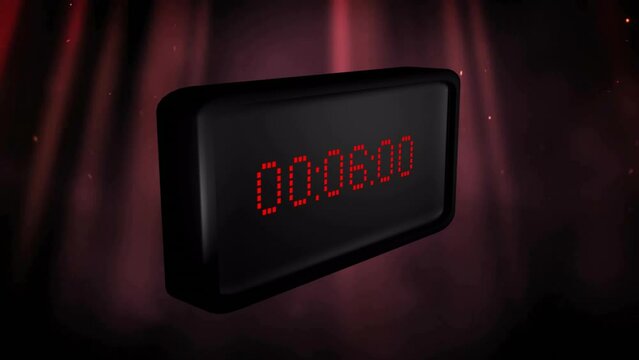 Animation of red digital timer changing with red light trails on black background