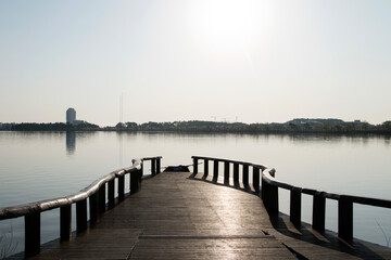 Fototapeta premium View of the wooden dock at the lakeside in the morning