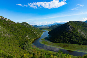 Fototapeta na wymiar Green pyramid, a mountain on the Crnojevich River or Black River, near the shores of Lake Skadar. Montenegro