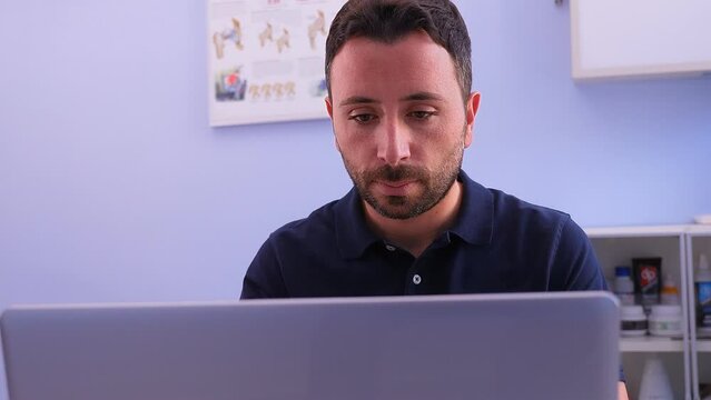 technology, physiotherapy-physiotherapist at the computer checks patient data