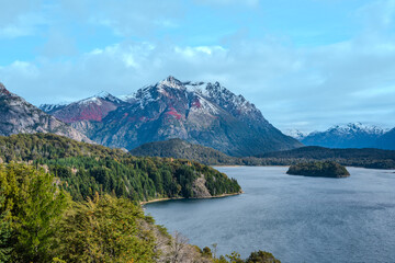 Naklejka na ściany i meble Barren Tree Silhouettes Against Patagonian Lake and Mountains