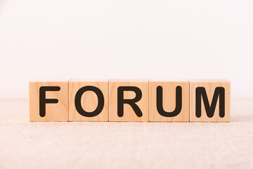 Word FORUM made with wood building blocks on a light background