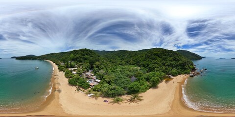 360 aerial photo taken with drone over long house on beach