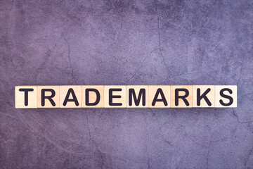 TRADEMARKS word made with wood building blocks.