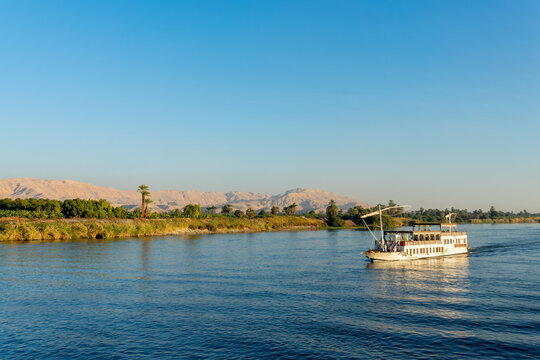 Traditional egyptian dahabiya boat cruising on the Nile river, Egypt