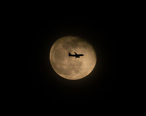 Airliner Crossing a Full Moon (two of three)