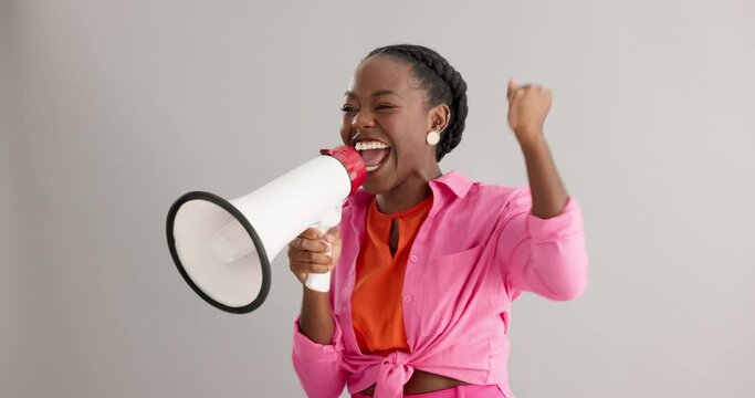 Megaphone, shout and excited black woman on gray background for news, announcement and information. Bullhorn, communication and person with speaker for discount, sale and bargain broadcast in studio