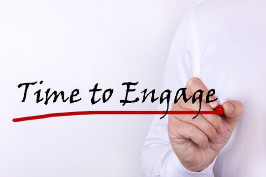 Hand writing inscription Time to engage with marker concept