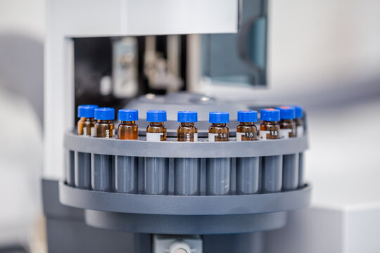 Close up of science experiment Vials filled inside an autosampler of an HPLC machine in a Science experiment laboratory for research analysis and clinical trial study
