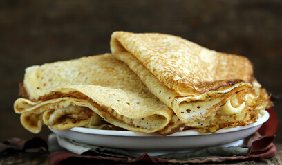 homemade thin pancakes with berries for breakfast and dessert