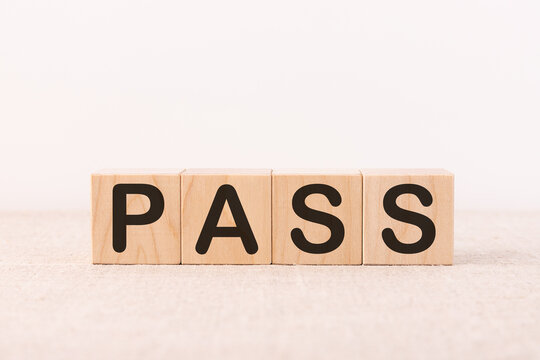 PASS word concept written on a light table and light background
