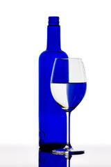 A blue Bottle with a wine glass