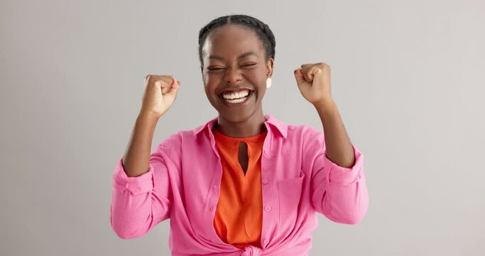 Yes, face and black woman with winner fist celebration in studio excited for competition results on grey background. Success, bonus or portrait of female model with emoji hands for giveaway promotion