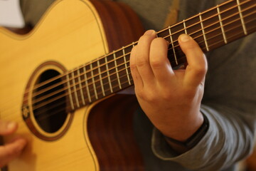 Fototapeta na wymiar Harmonic Finesse: Hands Crafting Chords