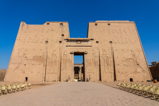 Entrance and facade of the ancient egyptian temple of Edfu on the Nile river West bank, Egypt