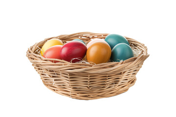 Obraz na płótnie Canvas Multicolored painted eggs in basket, transparent background - festive culture