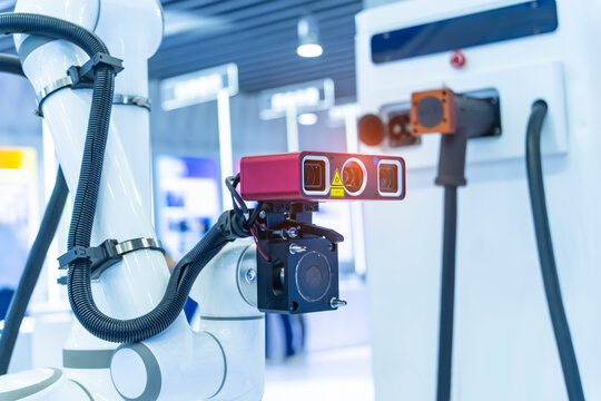 smart robot in manufacturing industry for industry 4.0 and technology concept. Robotic vision sensor camera system for electric vehicles battery charge service