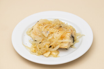 Traditional portuguese cousine, cod fish onions with oil.