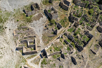 Aerial view of ruins of village of Escó by Yesa reservoir in Spain, Summer 2023