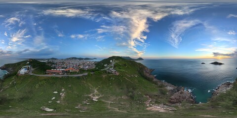 360 aerial photo taken with drone of viewpoint on top of hill overlooking city during cliffside...