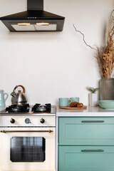 Kitchen interior with retro style, cupboard, gas stove and extractor hood