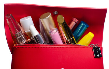 Red cosmetic bag with cosmetic lipstick mascara perfume make up beauty on white background isolation, macro