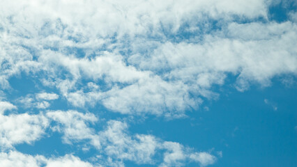 blue sky and clouds close up view from below