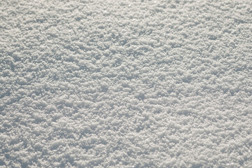 gray background, photo shows snow close-up