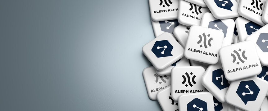 Logos of the German most important AI startups  "Aleph Alpha" (generative AI) and "Deepl" (automated translation services) on a heap on a table. Web banner format with copy space,