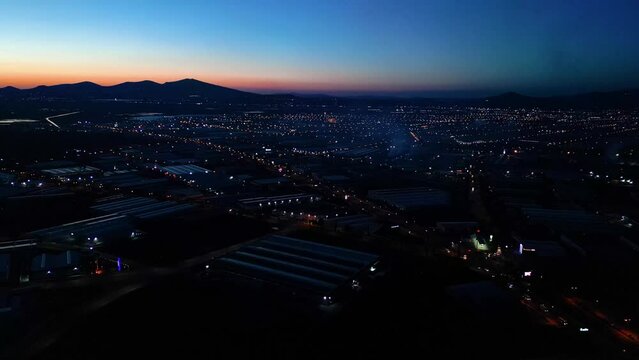 Aerial View of Factories with Evening Traffic on City Roads