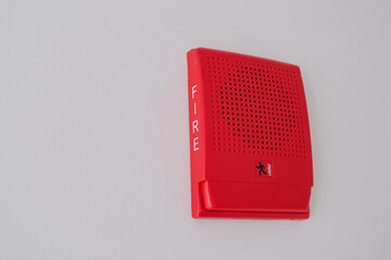 Installed red fire alarm box speaker on the wall, emergency equipment first aid